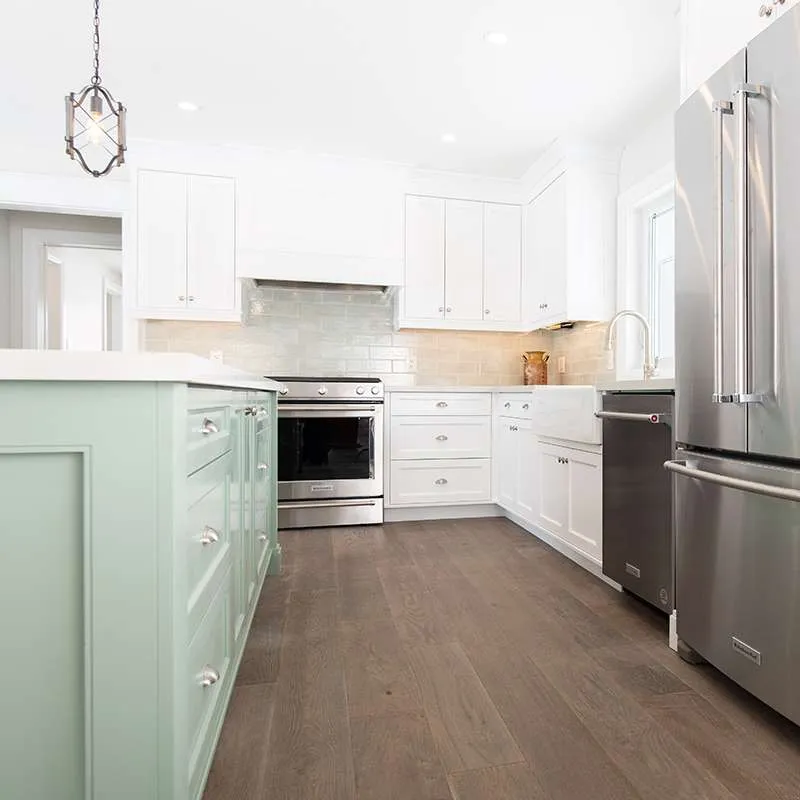 Custom kitchen renovation with mint green island by Revel Homes, Collingwood Ontario