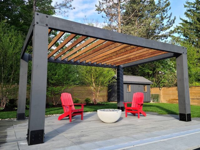 Backyard pergola and fire bowl built by Revel Homes