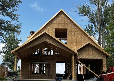 Revel Homes crew framing the roof of a custom home under construction in Wasaga Beach